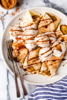 Banana Foster Crepes combine two of my favorite desserts – homemade crepes and bananas fosters! This slimmed down make-over is delicious and perfect anytime you're craving something sweet!