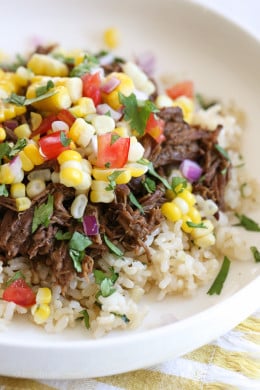 Barbacoa Beef with corn salsa on a plate.