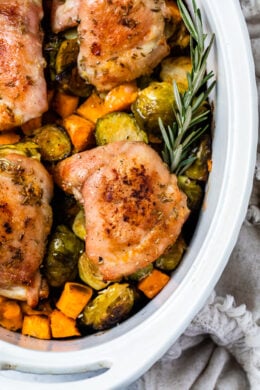 Baked Chicken Thighs with Brussels Sprouts and Sweet Potato, a quick and easy one-pot chicken dinner for a chilly, fall night.