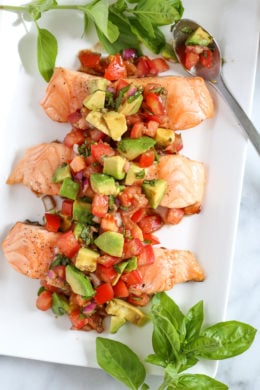 Grilled salmon is so easy to make with this foolproof method, you'll be grilling it outdoors all summer long! Topped with this fresh avocado bruschetta, this dish just screams summer!