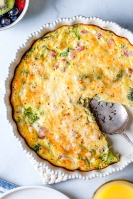 This low-carb Crustless Ham and Cheese Quiche is light and delicious, perfect for breakfast or brunch (or even a light dinner)! Made with a leftover ham or ham steak, broccoli and Swiss Cheese.