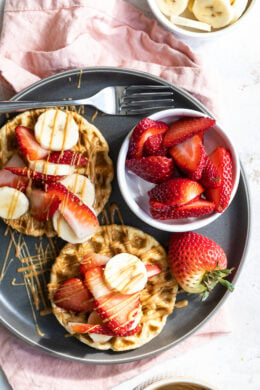 Oat Waffles with strawberries, peanut butter and bananas.