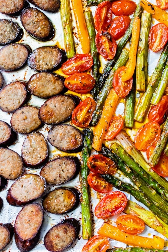 Kielbasa Veggie Sheet Pan Dinner is made with turkey kielbasa, asparagus, tomatoes and bell peppers cooked all on one pan, easy cleanup! It's also Keto, Whole30, Low Carb and Gluten-free.