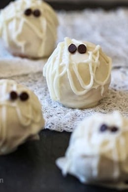 Easy Skinny Halloween mummy cake balls made light by using a box cake mix, egg whites and fat free Greek yogurt – no butter required!