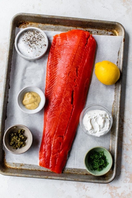 whole raw salmon, lemon, mustard, dill