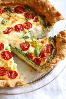 This easy vegetarian quiche recipe is made with spinach, ricotta cheese, eggs, tomatoes and basil. Perfect for breakfast, lunch or brunch or serve it with a salad for a light dinner.