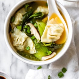 Loaded with vegetables, this quick and easy wonton soup is super simple, and takes under 15 minutes to make thanks to the frozen wontons.