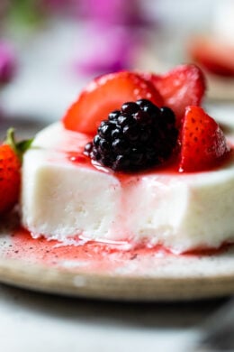 This simple Yogurt Panna Cotta is the perfect smooth, creamy dessert. The cool tang of yogurt pairs perfectly with fresh berries. To macerate the berries simple mix them with a little sugar and let them sit.